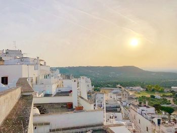 High angle view of townscape against sky at sunset