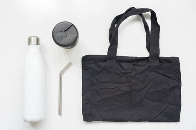 High angle view of black coffee on table against white background