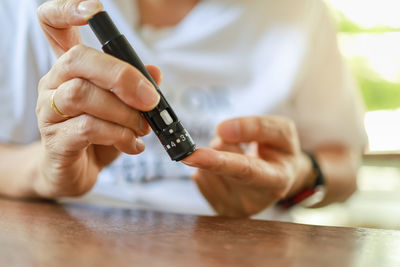 Close-up of man working on table