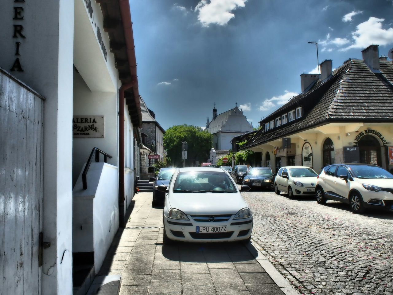 CAR ON STREET IN CITY