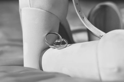 Close-up of wedding rings on seat