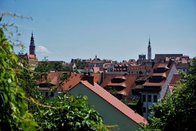 Buildings in city against clear sky