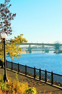 Bridge over river against blue sky