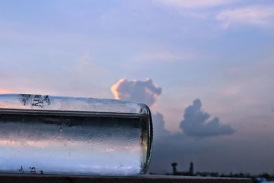 Close-up of boat against sky during sunset