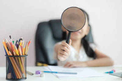 Midsection of woman working with umbrella