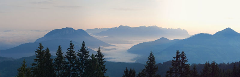 Panoramic view of mountains against sky during sunset