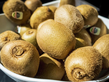 Close-up of fresh whole fruits on bowl.