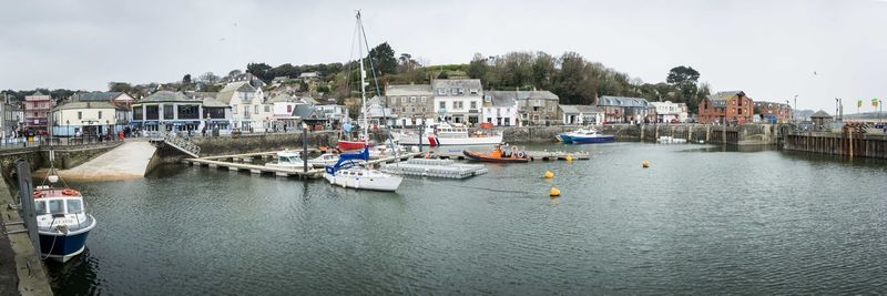 Boats moored at harbor