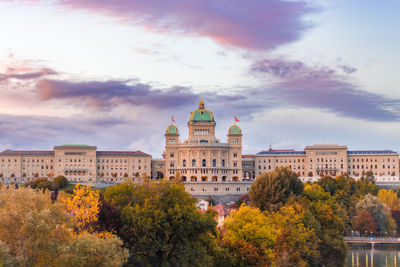 Buildings in city against sky