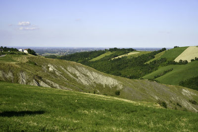 Scenic view of landscape and sea against sky