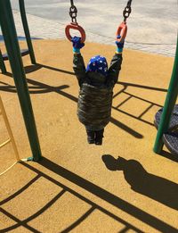 High angle view of boy playing in playground