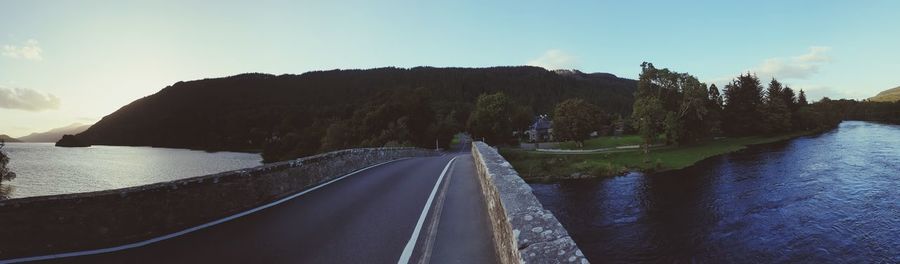 Road by sea against sky