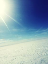 Scenic view of landscape against blue sky