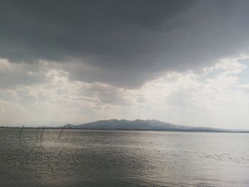 Scenic view of sea against cloudy sky