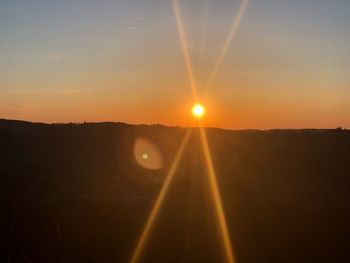 Scenic view of silhouette landscape against sky during sunset