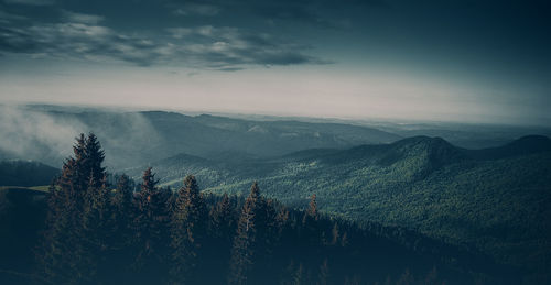 Scenic view of mountains against sky during winter