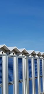Low angle view of building against clear blue sky