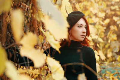 Portrait of a young woman standing outdoors