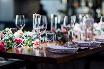 Luxury table settings for fine dining with and glassware, pouring wine to glass.beautiful background