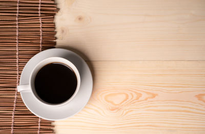 High angle view of black coffee on table