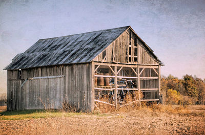 House on field against sky