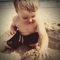 Portrait of boy playing on beach