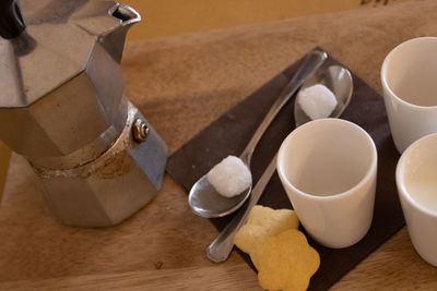 High angle view of coffee cups on table