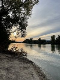 Scenic view of lake against sky during sunset