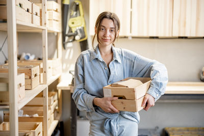 Portrait of smiling man standing in box