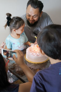 High angle view of family during birthday