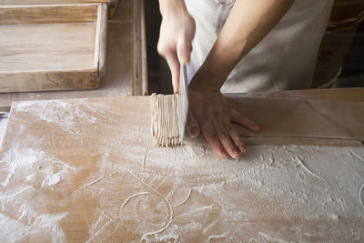 Woman preparing noodles