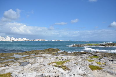 Scenic view of beach against sky