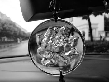 Close-up of electric lamp hanging in car
