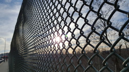 Chainlink fence seen through chainlink fence