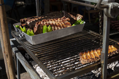 High angle view of meat on barbecue grill