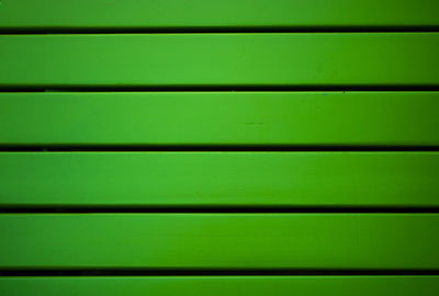 Abstract green and black background.