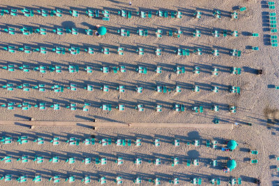 Bathouses and neatly ordered beach chairs and umbrellas