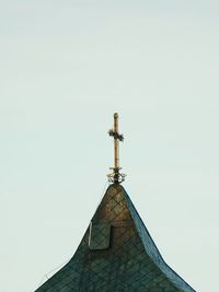 Low angle view of cross against clear sky