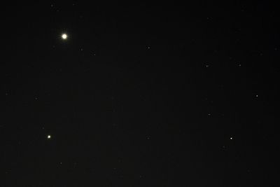 Low angle view of moon against sky at night