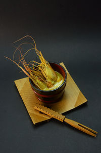 Close-up of food on table against black background