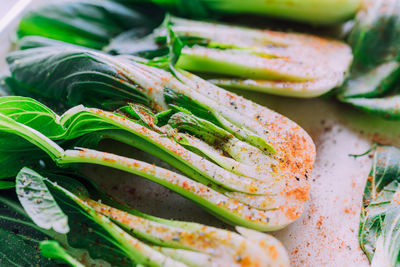 Spiced close up fresh, juicy bokchoy sliced in half