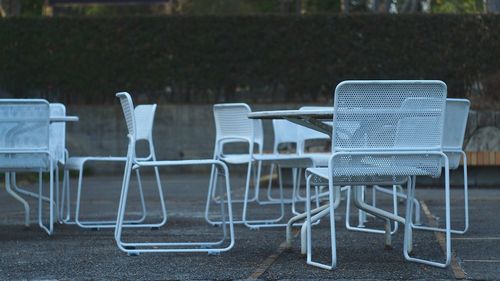 Chairs and tables on sidewalk