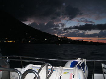 Scenic view of lake against sky at night
