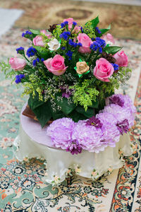 High angle view of pink flower on table