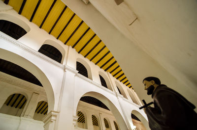 Low angle view of jesus christ statue with cross in church