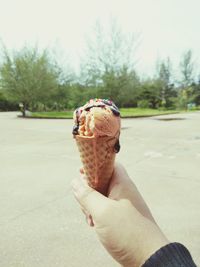 Person holding ice cream cone