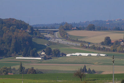 Scenic view of farm against sky