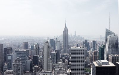 Skyscrapers in city against sky