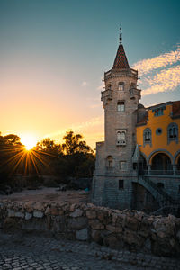 Historic building against sky during sunset