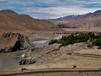 Scenic view of landscape and mountains against sky